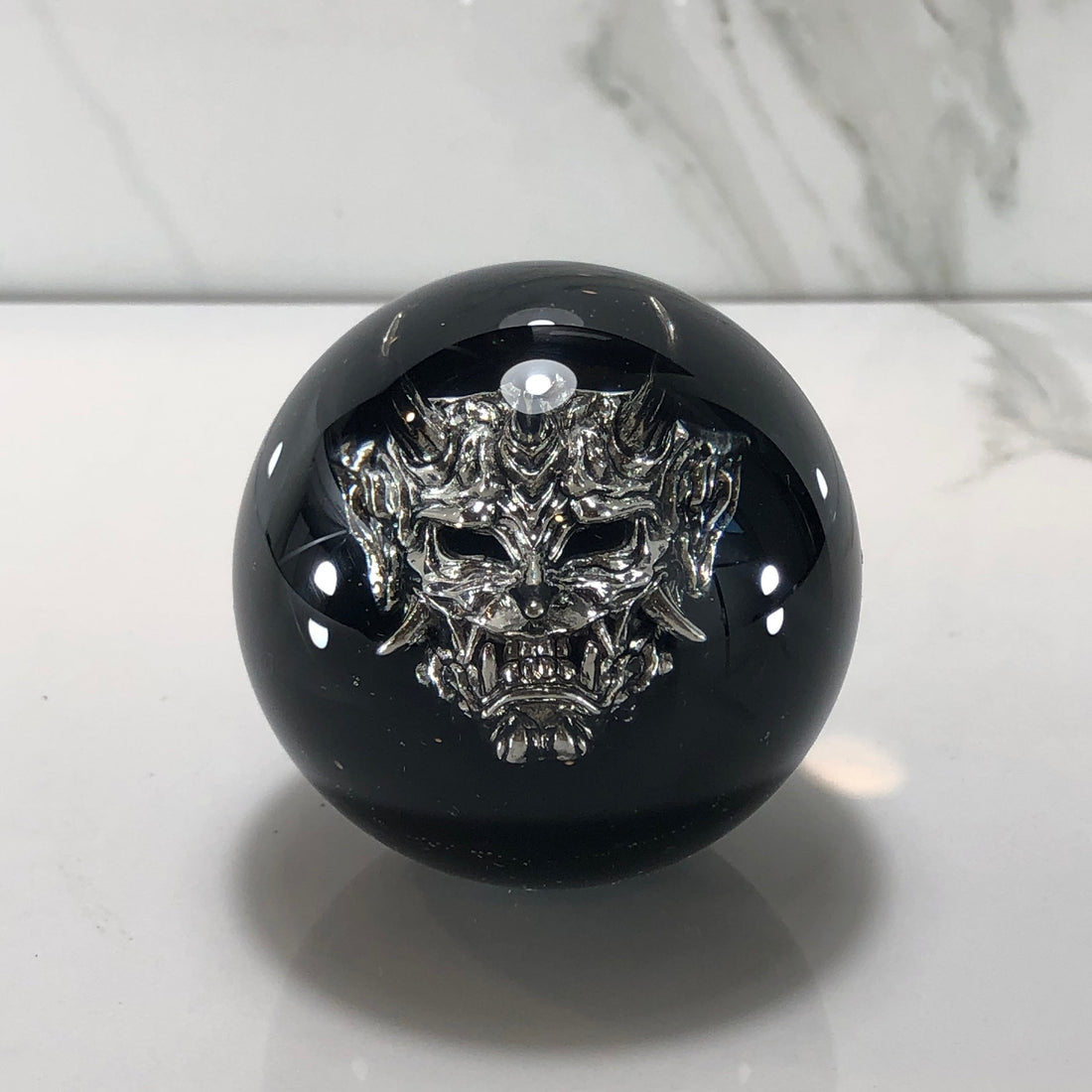 A 60mm oni mask resin shift knob