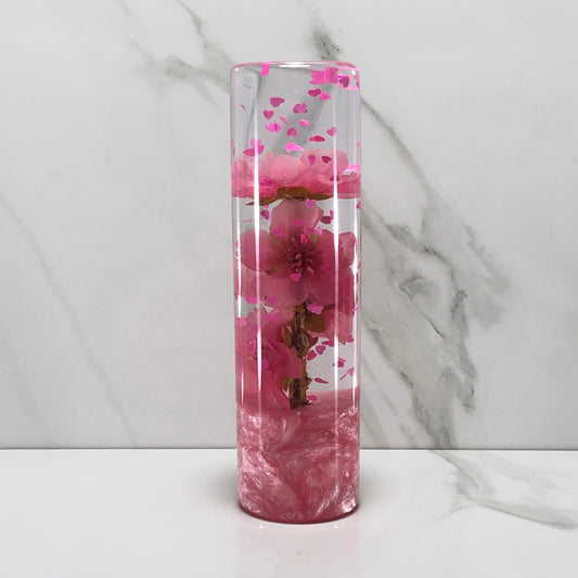 A 140mm pink glitter blossom heart resin shift knob